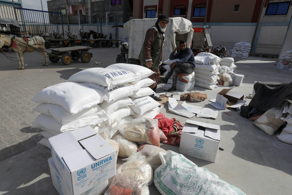 Palestinians,Receive,Their,Food,Rations,From,The,United,Nations,Relief
